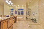 Master bathroom with separate bathtub and shower